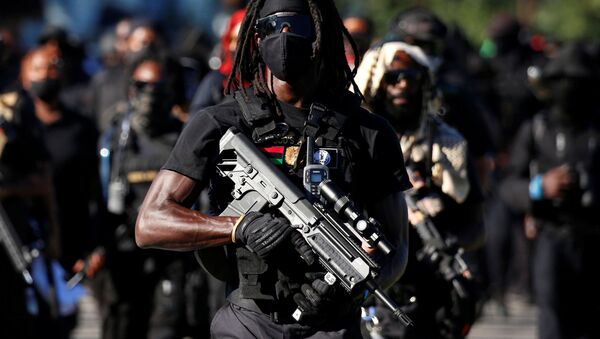 Members of a Black militia group called the NFAC march while armed in protest over the police killing of Breonna Taylor on the day of the Kentucky Derby horse race in Louisville, Kentucky, U.S. September 5, 2020. - Sputnik International