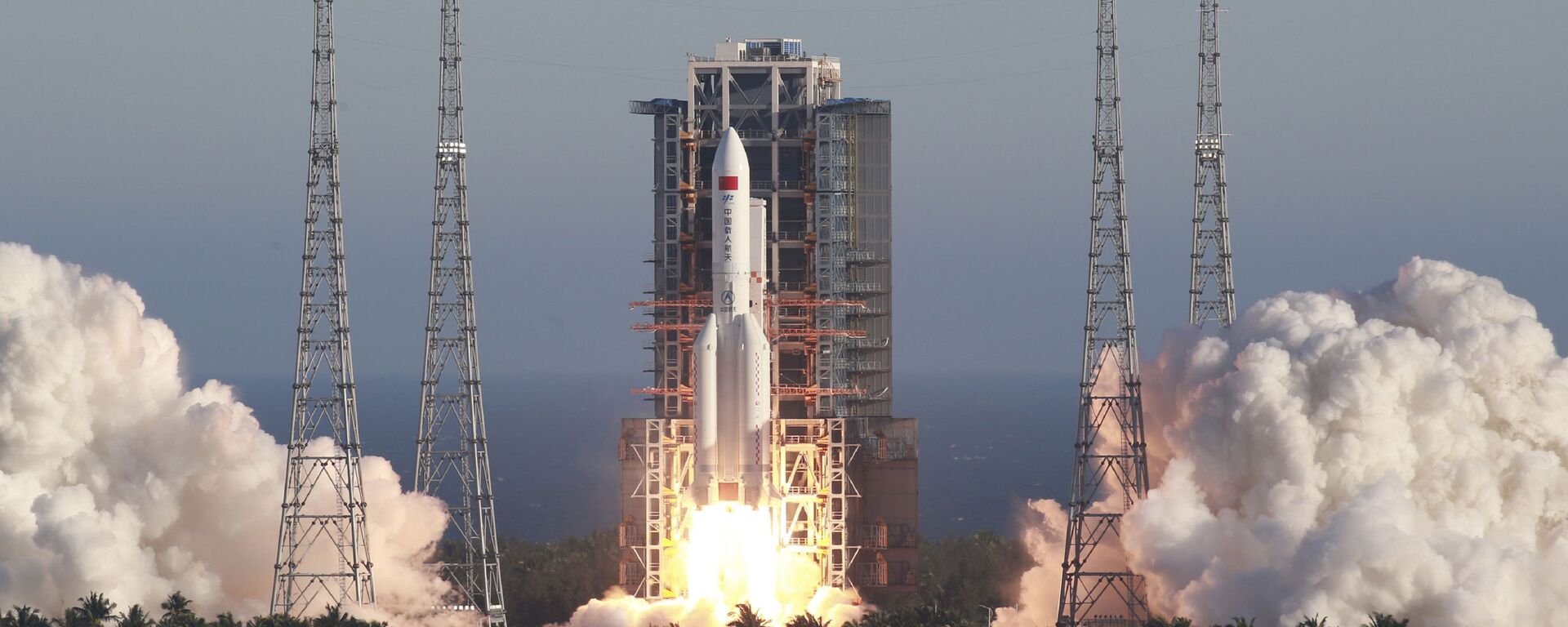 In this May 5, 2020, file photo released by Xinhua News Agency, China's new large carrier rocket Long March 5B blasts off from the Wenchang Space Launch Center in southern China's Hainan Province. An experimental version of China’s latest-generation crewed shape ship is operating normally, the government says, despite an apparent malfunction aboard a cargo return capsule. - Sputnik International, 1920, 26.04.2023