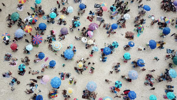 People enjoy at Ipanema beach, amid the coronavirus disease (COVID-19) outbreak, in Rio de Janeiro, Brazil September 6, 2020. Picture taken with a drone. - Sputnik International