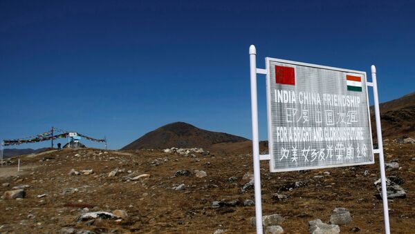 A signboard is seen from the Indian side of the Indo-China border at Bumla, in the northeastern Indian state of Arunachal Pradesh, November 11, 2009 - Sputnik International