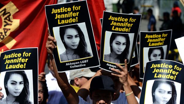 Supporters of the late Jennifer Laude hold up her image during a protest near a Philippine court in Olongapo, north of Manila on 23 February 2015 - Sputnik International