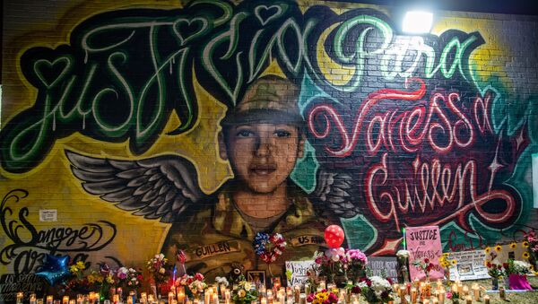 Flowers adorn a mural of Vanessa Guillen, a soldier based at nearby Fort Hood on July 6, 2020 in Austin, Texas. - Sputnik International