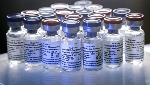 In this handout photo taken on Thursday, Aug. 6, 2020, and provided by Russian Direct Investment Fund, a new vaccine is on display at the Nikolai Gamaleya National Center of Epidemiology and Microbiology in Moscow, Russia - Sputnik International