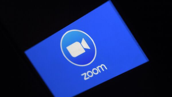 In this file photo illustration a Zoom App logo is displayed on a smartphone on March 30, 2020 in Arlington, Virginia. - Zoom shares soared on August 31 after the video-meeting service reported that quarterly revenue rocketed as its ranks of users more than quadrupled - Sputnik International