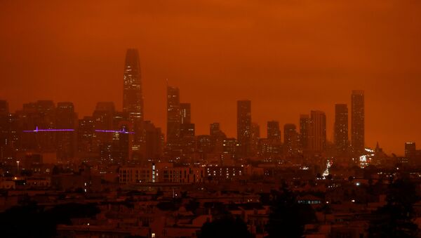 Downtown San Francisco is seen from Dolores Park under an orange sky darkened by smoke from California wildfires in San Francisco, California, U.S. September 9, 2020. - Sputnik International