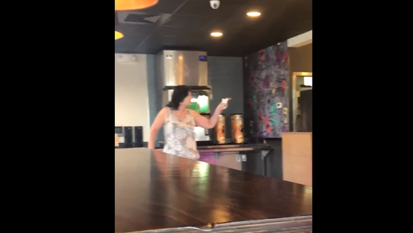Screenshot from a video showing a woman insulting Taco Bell staffers and claiming she is Charles Manson's daughter - Sputnik International