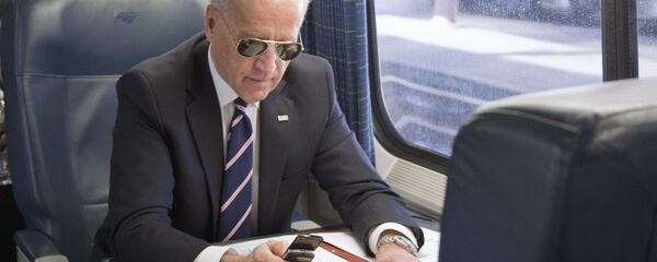 Vice President Joe Biden makes a phone call on a train at Union Station in Washington, Tuesday, Feb. 8, 2011, as he headed to an event in Philadelphia to tout plans to improve the nation's infrastructure Vice President Joe Biden makes a phone call on a train at Union Station in Washington, Tuesday, Feb. 8, 2011, as he headed to an event in Philadelphia to tout plans to improve the nation's infrastructure - Sputnik International