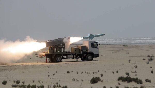 In this photo provided Thursday, June 18, 2020, by the Iranian Army, a missile is launched during a naval exercise. State media reported Thursday that Iran test-fired cruise missiles in a naval exercise in the Gulf of Oman and the northern Indian Ocean. The report by the official IRNA news agency said the missiles destroyed targets at a distance of 280 kilometres (170 miles - Sputnik International