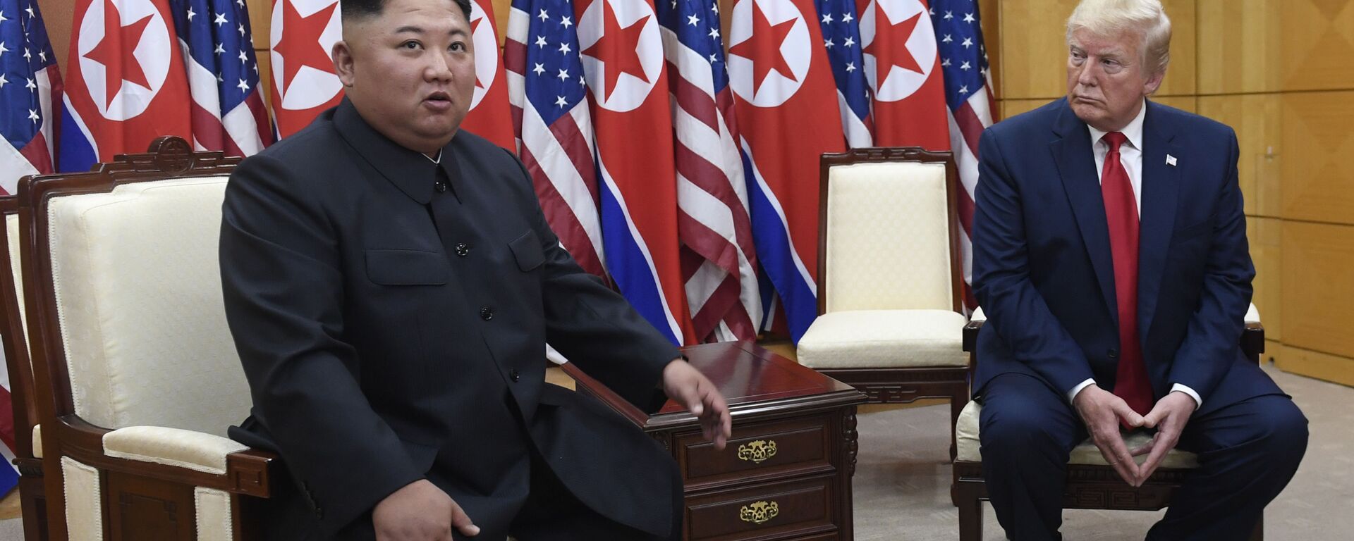  In this June 30, 2019, file photo President Donald Trump, right, listens as North Korean leader Kim Jong Un, left, speaks during their bilateral meeting inside the Freedom House at the border village of Panmunjom in the Demilitarized Zone, South Korea - Sputnik International, 1920, 18.09.2021