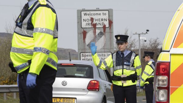 In this file photo taken on April 09, 2020 Irish Police (Garda) stop and check vechicles at the border crossing at Carrkcarnon, County Louth, Ireland, on April 9, 2020 under new powers to curb non-essential travel during the coronavirus crisis. - Sputnik International