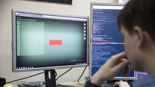 An employee of Global Cyber Security Company Group-IB develops a computer code in an office in Moscow, Russia, Wednesday, Oct. 25, 2017. A new strain of malicious software has paralyzed computers at a Ukrainian airport, the Ukrainian capital's subway and at some independent Russian media. Moscow-based Global Cyber Security Company Group-IB said in a statement Wednesday the ransomware called BadRabbit also tried to penetrate the computers of major Russian banks but failed. None of the banks has reported any attacks.  - Sputnik International