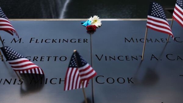 NEW YORK, NEW YORK - JULY 04: A flower is placed on a name at the 9/11 memorial plaza on the first day that it has reopened after closing for three months due to the coronavirus on on July 04, 2020 in New York City. - Sputnik International
