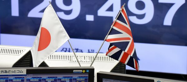 In this file photo taken on October 07, 2016 Japanese and British flags are placed in front of a monitor showing the Japanese yen rate against the British pound at a brokerage in Tokyo on October 7, 2016 In this file photo taken on October 07, 2016 Japanese and British flags are placed in front of a monitor showing the Japanese yen rate against the British pound at a brokerage in Tokyo on October 7, 2016 - Sputnik International