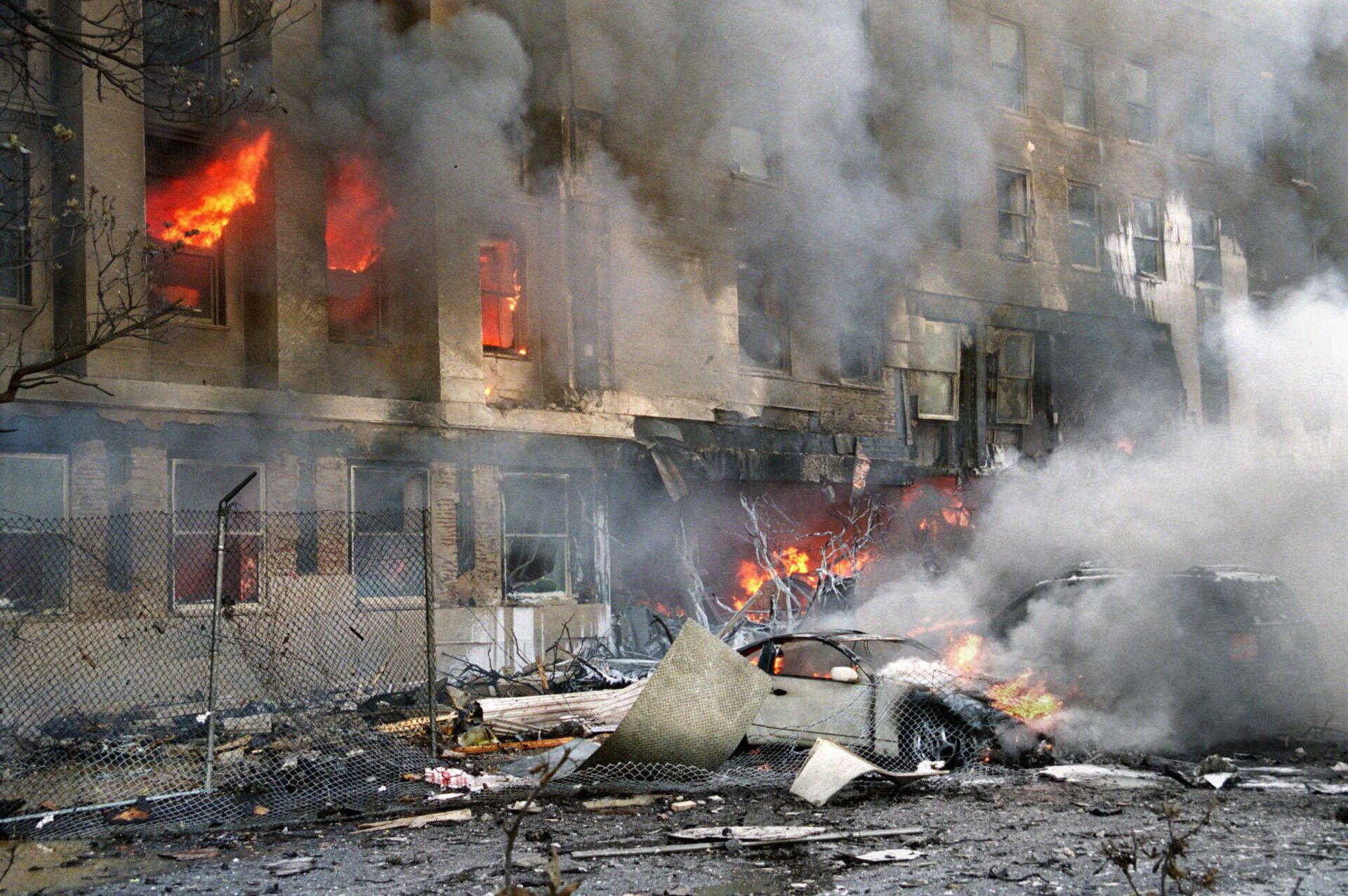 In this 11 September 2001 file photo, damage to the outer ring of the Pentagon is shown after a hijacked airliner crashed into the building - Sputnik International, 1920, 07.09.2021