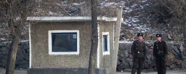 North Korean soldiers look as they stand guard along the river bank of the North Korean town of Sinuiju, opposite side to the Chinese border city of Dandong, Tuesday, Dec. 20, 2011 North Korean soldiers look as they stand guard along the river bank of the North Korean town of Sinuiju, opposite side to the Chinese border city of Dandong, Tuesday, Dec. 20, 2011 - Sputnik International