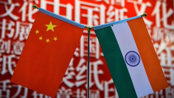 The national flags of India (R) and China are seen at the Delhi World Book fair at Pragati Maidan in New Delhi on January 9, 2016. - Sputnik International