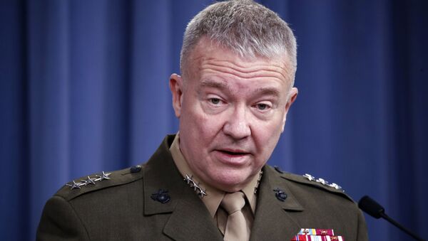 In this April1 14, 2018, file photo, then-Marine Lt. Gen. Kenneth Frank McKenzie speaks during a media availability at the Pentagon in Washington. McKenzie, the Marine general overseeing the U.S. war effort in Afghanistan says the Islamic State affiliate there has hopes of attacking the U.S. homeland. But McKenzie says the extremist group’s aspirations are being frustrated by American counterterrorism operations in its strongholds in northeastern Afghanistan.  - Sputnik International