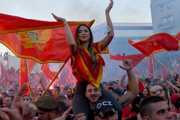 Self-described patriots wave flags during a post-election rally in Podgorica, on September 6, 2020 - Sputnik International