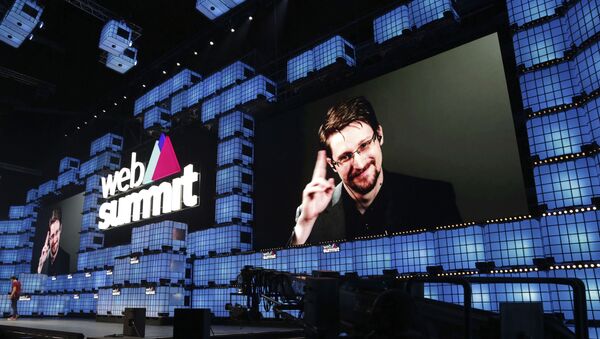Former U.S. National Security Agency contractor Edward Snowden addresses attendees through video link at the Web Summit technology conference in Lisbon, Monday, Nov. 4, 2019. Snowden has been living in Russia to escape U.S. prosecution after leaking classified documents detailing government surveillance programs - Sputnik International