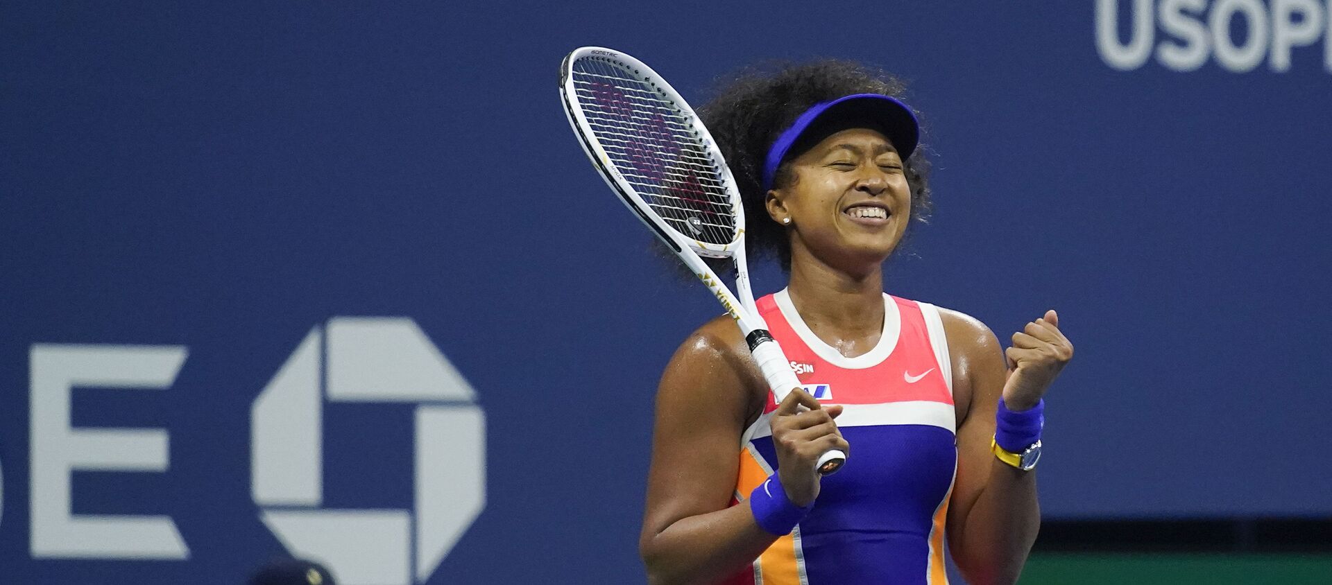 Naomi Osaka, of Japan, reacts after defeating Jennifer Brady, of the United States, during a semifinal match of the US Open tennis championships, Thursday, 10 September 2020, in New York - Sputnik International, 1920, 31.05.2021