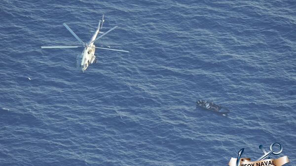 Aerial photo of a Mexican Navy helicopter flying over a speed boat suspected of being loaded with cocaine in the Caribbean Sea off the coast of the Mexican state of Quintana Roo, 1 September 2020. - Sputnik International