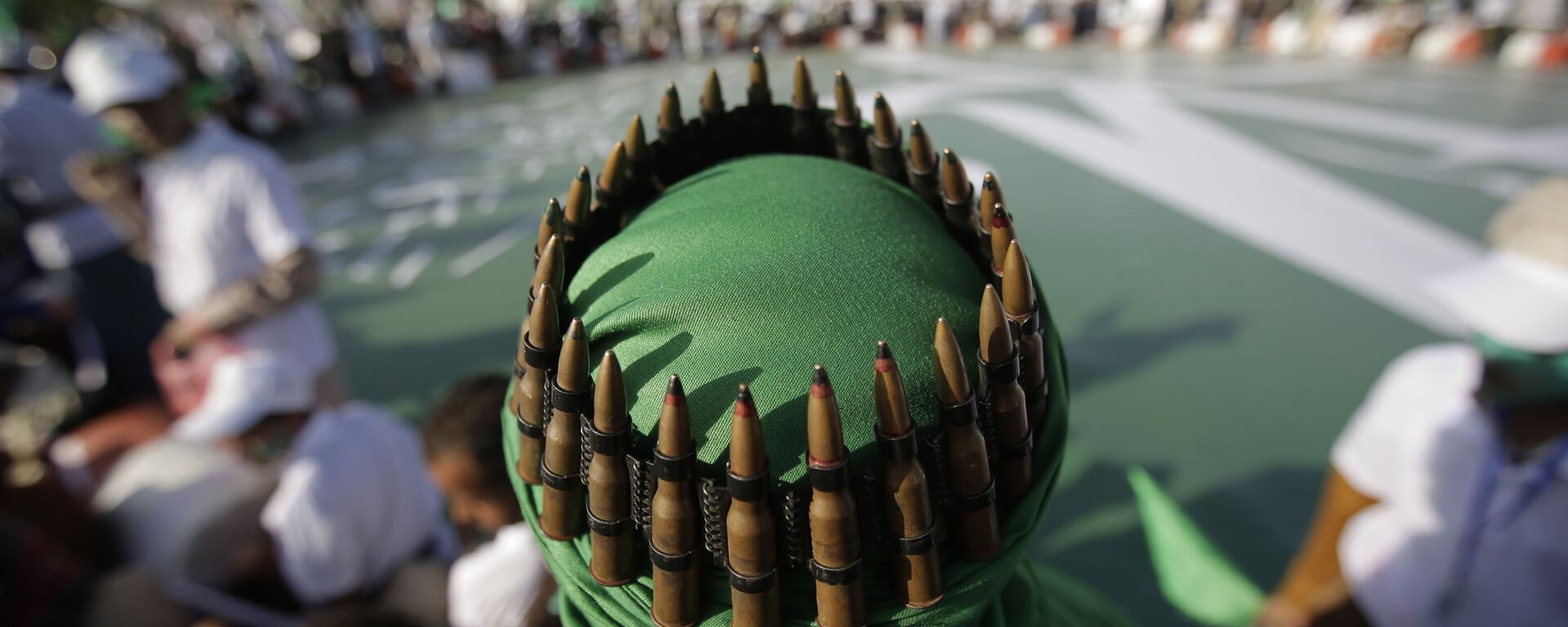 A supporter of Shiite rebels, known as Houthis, with an ammunition belt placed on his head attends a celebration of Moulid al-nabi, the birth of Islam's prophet Muhammad in Sanaa, Yemen, Saturday, Nov. 9, 2019 - Sputnik International, 1920, 15.03.2024