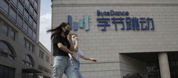 Women wearing masks to prevent the spread of the coronavirus chat as they pass by the ByteDance headquarters in Beijing, China on Friday, Aug. 7, 2020. President Donald Trump on Thursday ordered a sweeping but unspecified ban on dealings with the Chinese owners of consumer apps TikTok and WeChat, although it remains unclear if he has the legal authority to actually ban the apps from the U.S. TikTok is owned by Chinese company ByteDance Women wearing masks to prevent the spread of the coronavirus chat as they pass by the ByteDance headquarters in Beijing, China on Friday, Aug. 7, 2020. President Donald Trump on Thursday ordered a sweeping but unspecified ban on dealings with the Chinese owners of consumer apps TikTok and WeChat, although it remains unclear if he has the legal authority to actually ban the apps from the U.S. TikTok is owned by Chinese company ByteDance - Sputnik International
