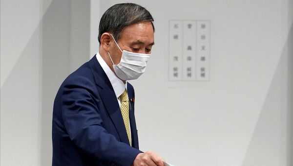 Japanese Chief Cabinet Secretary Yoshihide Suga casts his ballot at the Liberal Democratic Party's (LDP) leadership election in Tokyo, Japan September 14, 2020.  - Sputnik International
