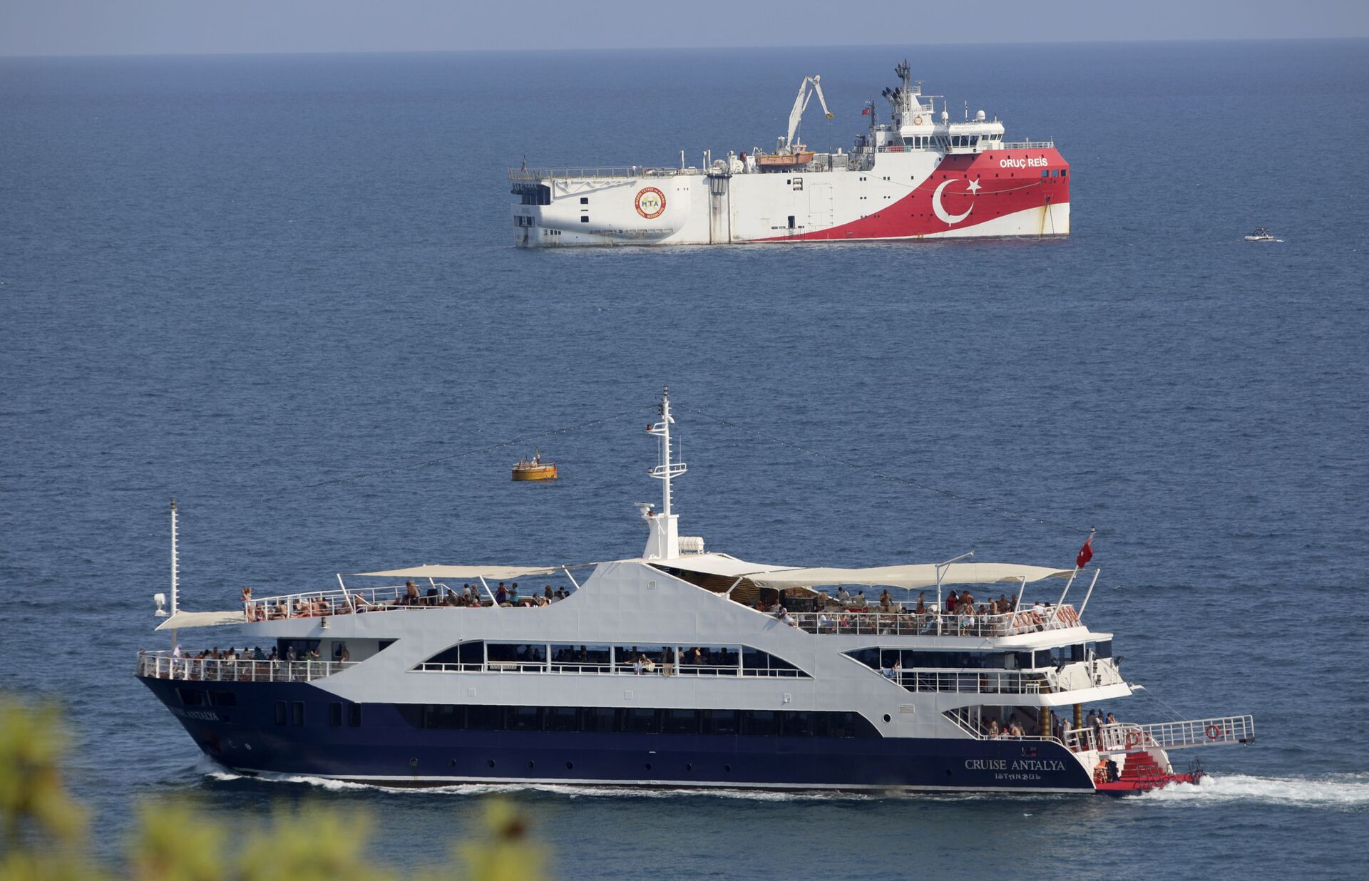 Turkey's research vessel, Oruc Reis, rear, anchored off the coast of Antalya on the Mediterranean, Turkey, Sunday, Sept. 13, 2020. Greece's Prime Minister Kyriakos Mitsotakis welcomed the return of a Turkish survey vessel to port Sunday from a disputed area of the eastern Mediterranean that has been at the heart of a summer stand-off between Greece and Turkey over energy rights. - Sputnik International, 1920, 07.09.2021