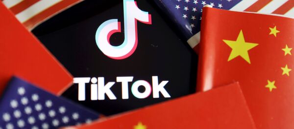 China and U.S. flags are seen near a TikTok logo in this illustration picture taken July 16, 2020. REUTERS/Florence Lo/Illustration China and U.S. flags are seen near a TikTok logo in this illustration picture taken July 16, 2020. REUTERS/Florence Lo/Illustration - Sputnik International