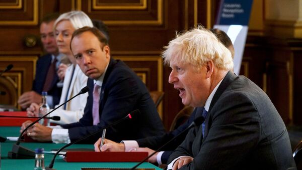 British Health Secretary Matt Hancock looks on as Prime Minister Boris Johnson speaks at a cabinet meeting at the Foreign Office in London, Britain September 15, 2020 - Sputnik International
