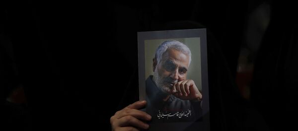 A Hezbollah supporter holds pictures of slain Iranian Revolutionary Guard Gen. Qassem Soleimani during a ceremony marking the anniversary of the assassination of Hezbollah leaders, Abbas al-Moussawi, Ragheb Harb and Imad Mughniyeh and the end of a 40-day Muslim mourning period for Soleimani, in the southern suburb of Beirut, Lebanon, Sunday, Feb. 16, 2020. Nasrallah said U.S. President Donald Trump declared war on the Middle East when the U.S. assassinated Soleimani and when the White House announced its plan to end the Palestinian-Israeli conflict. He called on all to resist U.S. influence and its troops presence. - Sputnik International