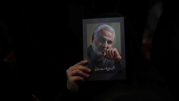 A Hezbollah supporter holds pictures of slain Iranian Revolutionary Guard Gen. Qassem Soleimani during a ceremony marking the anniversary of the assassination of Hezbollah leaders, Abbas al-Moussawi, Ragheb Harb and Imad Mughniyeh and the end of a 40-day Muslim mourning period for Soleimani, in the southern suburb of Beirut, Lebanon, Sunday, Feb. 16, 2020. Nasrallah said U.S. President Donald Trump declared war on the Middle East when the U.S. assassinated Soleimani and when the White House announced its plan to end the Palestinian-Israeli conflict. He called on all to resist U.S. influence and its troops presence. - Sputnik International