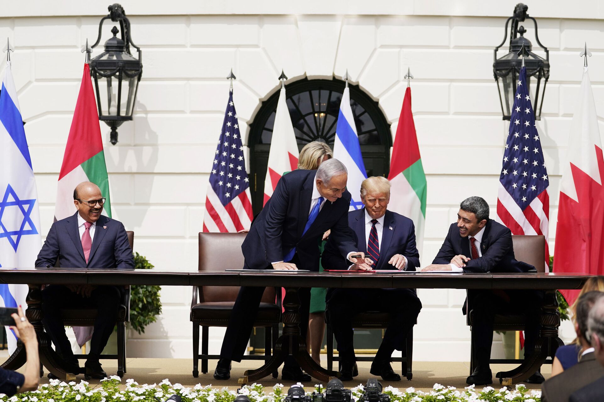 President Donald Trump, center, with from left, Bahrain Foreign Minister Khalid bin Ahmed Al Khalifa, Israeli Prime Minister Benjamin Netanyahu, Trump, and United Arab Emirates Foreign Minister Abdullah bin Zayed al-Nahyan, during the Abraham Accords signing ceremony on the South Lawn of the White House, Tuesday, Sept. 15, 2020, in Washington. (AP Photo/Alex Brandon) - Sputnik International, 1920, 12.12.2021