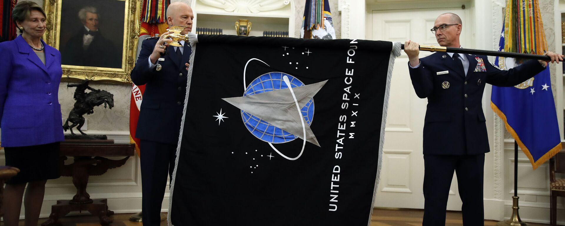 Chief of Space Operations at US Space Force Gen. John Raymond, center, and Chief Master Sgt. Roger Towberman, right, hold the United States Space Force flag as it is presented in the Oval Office of the White House, Friday, May 15, 2020, in Washington.  Secretary of the Air Force Barbara Barrett stands far left. - Sputnik International, 1920, 15.02.2024