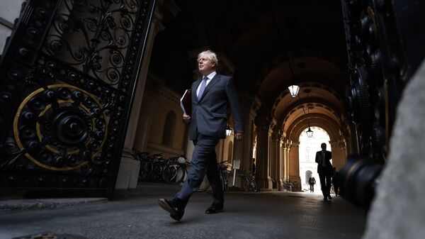 Britain's Prime Minister Boris Johnson walks to his office in Downing Street after a cabinet meeting in London, Tuesday, Sept. 15, 2020. - Sputnik International