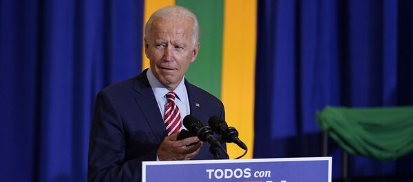 Democratic presidential candidate former Vice President Joe Biden plays music on a phone as he arrives to speak at a Hispanic Heritage Month event, Tuesday, Sept. 15, 2020, at Osceola Heritage Park in Kissimmee, Fla. Democratic presidential candidate former Vice President Joe Biden plays music on a phone as he arrives to speak at a Hispanic Heritage Month event, Tuesday, Sept. 15, 2020, at Osceola Heritage Park in Kissimmee, Fla. - Sputnik International