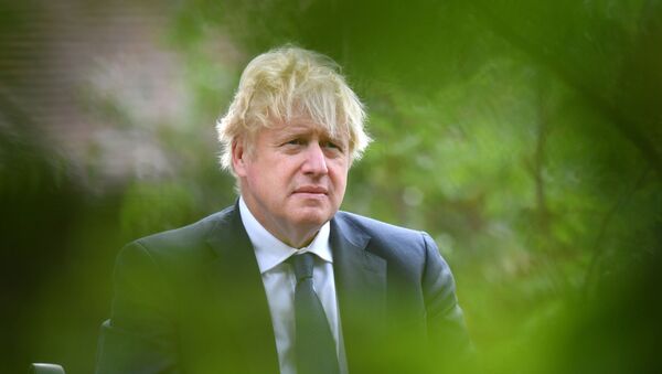 Britain's Prime Minister Boris Johnson attends a national service of remembrance at the National Memorial Arboretum in Alrewas, central England on August 15, 2020, to mark the 75th anniversary of VJ (Victory over Japan) Day.  - Sputnik International