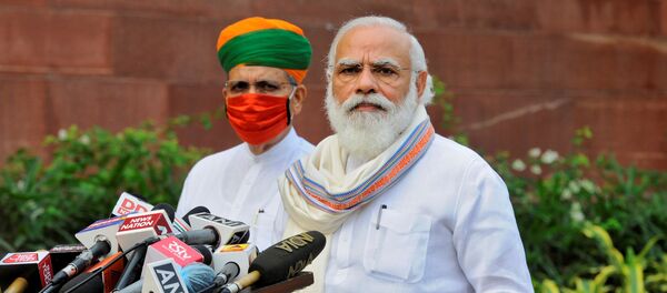 India's Prime Minister Narendra Modi looks on as he speaks to the media inside the parliament's premises on the first day of the monsoon session in New Delhi, India, 14 September 2020 India's Prime Minister Narendra Modi looks on as he speaks to the media inside the parliament's premises on the first day of the monsoon session in New Delhi, India, 14 September 2020 - Sputnik International