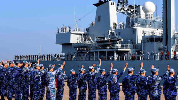 Soldiers of the Chinese People's Liberation Army (PLA) Navy take part in a ceremony as a replenishment ship sets sail to the Gulf of Aden and the waters off Somalia, from a naval port in Qingdao, Shandong province, China September 3, 2020 - Sputnik International