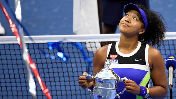 Sep 12 2020; Flushing Meadows, New York, USA; Naomi Osaka of Japan celebrates with the championship trophy after her match against Victoria Azarenka of Belarus (not pictured) in the women's singles final on day thirteen of the 2020 U.S. - Sputnik International