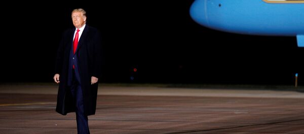 US President Donald Trump walks on the tarmac as he arrives for a campaign event at the Central Wisconsin Airport in Mosinee, Wisconsin, US, September 17, 2020 - Sputnik International