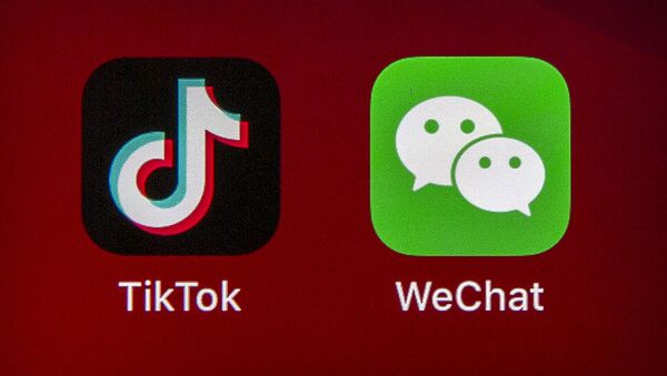 Icons for the smartphone apps TikTok and WeChat are seen on a smartphone screen in Beijing, 7 August 2020 - Sputnik International