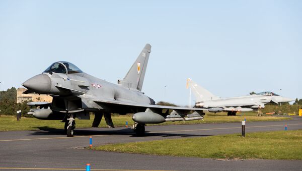 RAF Typhoons scrambled to intercept Russian planes flying over neutral waters in the North Sea. - Sputnik International