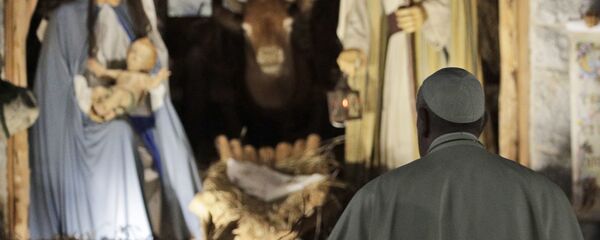In this Dec. 31, 2019 file photo, Pope Francis stops by the Nativity exposed in St. Peter's square after presiding over vespers of the Feast of St. Mary and Te Deum of Thanksgiving at year's end, in St. Peter's Basilica at the Vatican. In this Dec. 31, 2019 file photo, Pope Francis stops by the Nativity exposed in St. Peter's square after presiding over vespers of the Feast of St. Mary and Te Deum of Thanksgiving at year's end, in St. Peter's Basilica at the Vatican. - Sputnik International