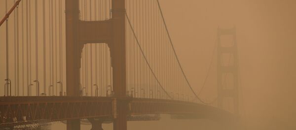 The Golden Gate Bridge is seen under a smoke filled sky from California wildfires in San Francisco, California, U.S., September 10, 2020. The Golden Gate Bridge is seen under a smoke filled sky from California wildfires in San Francisco, California, U.S., September 10, 2020. - Sputnik International