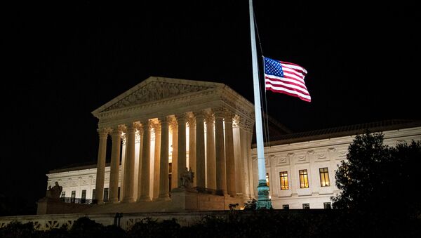 The American flag flies at half staff following the death of U.S. Supreme Court Justice Ruth Bader Ginsburg, outside of the U.S. Supreme Court, in Washington, U.S., September 18, 2020. - Sputnik International