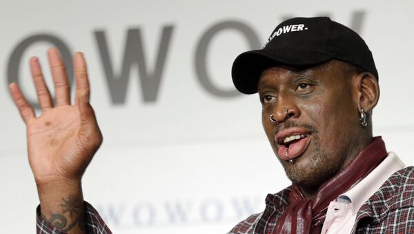 In this 25 October 2013, file photo, former basketball player Dennis Rodman waves during a news conference to promote a Japanese cable network’s coverage of the upcoming NBA season in Tokyo. - Sputnik International