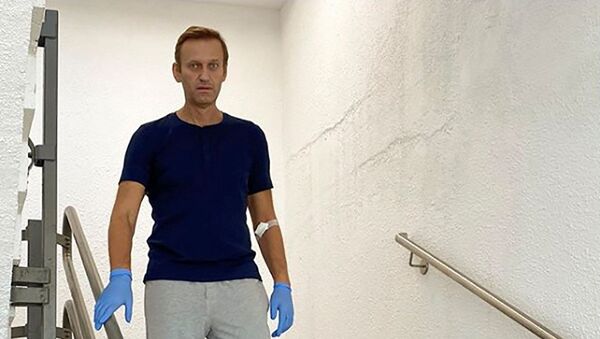 Russian opposition politician Alexei Navalny goes downstairs at Charite hospital in Berlin, Germany, in this undated image obtained from social media September 19, 2020 - Sputnik International