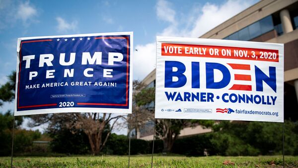 Yard signs supporting U.S. President Donald Trump and Democratic U.S. presidential nominee and former Vice President Joe Biden are seen outside of an early voting site at the Fairfax County Government Center in Fairfax, Virginia, U.S., September 18, 2020. - Sputnik International